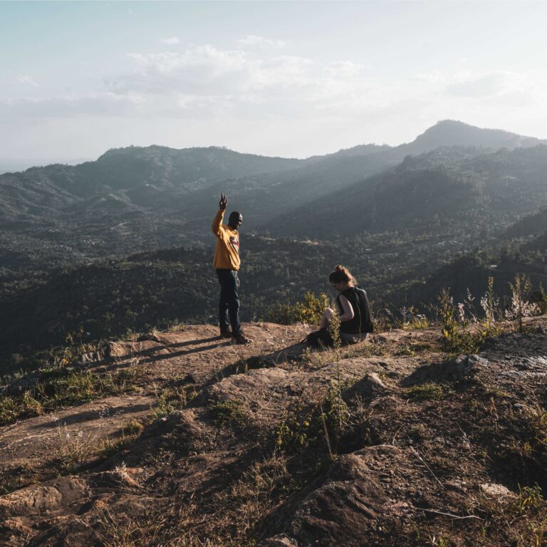 Runners crossing a mountain trail in Tanzania
